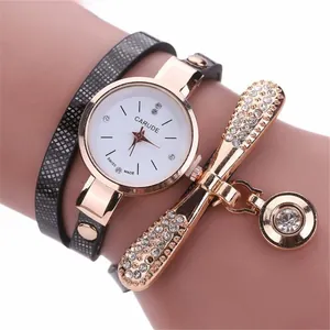 Macro detail of a women's leather wrap quartz watch with sparkling rhinestones on the band