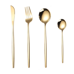 Golden 4-piece stainless steel cutlery set with knife, fork, and spoons on white background
