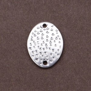 Oval hammered silver stainless steel connector for DIY jewelry making on dark felt