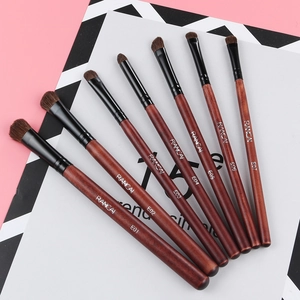 Close-up of 7-piece horse hair eyeshadow brushes with faux wood handles and metal ferrules