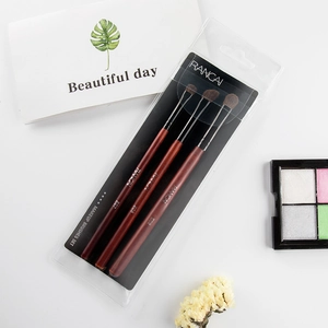 Detailed set of three horse hair eye makeup brushes with mahogany finish handles and PVC bag