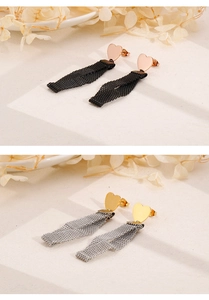 Detailed shot of heart stud earrings with metallic mesh tassels in gold and rose gold
