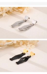 Detailed view of heart-shaped earrings with long mesh chain tassels in gold and silver