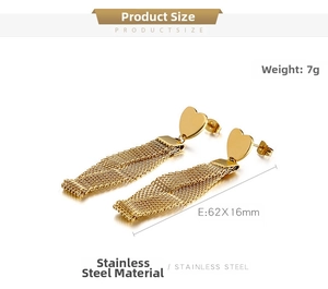 Detail view of gold heart tassel earrings showing 62mm length and stainless steel texture