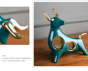 Detail of modern dark green ceramic bull sculpture with hollow design and golden horns