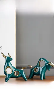Modern emerald green ceramic bull sculptures with gold accents for home decor set