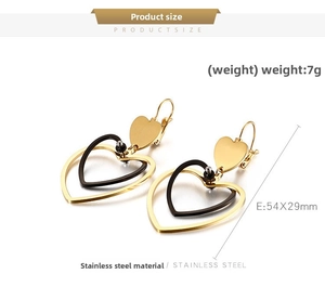 Detail of double heart earrings in gold and black stainless steel, 54x29mm size
