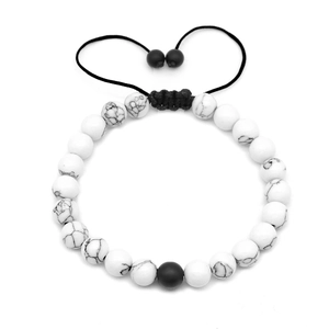 Adjustable 8mm white pine stone bead bracelet with black accent and woven cord
