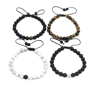Detail view of adjustable 8mm beaded bracelets with tiger eye and white pine stones