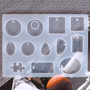 Detailed view of silicone resin mold with multi-shape holes for DIY earring making