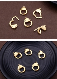 Detailed close-up of golden stainless steel handcuff clasp charm for DIY jewelry making