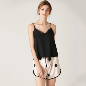 Detail of V-neck camisole with eyelash lace and polka dot satin pajama shorts