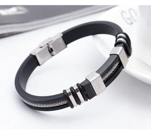 Detail of men's punk bracelet with black silicone and stainless steel chain inlay