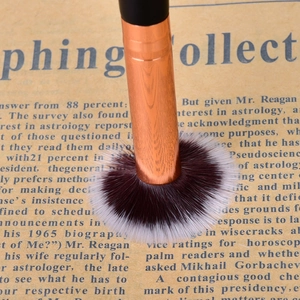 Detail showing the softness and resilience of synthetic bristles on a rose gold eye brush