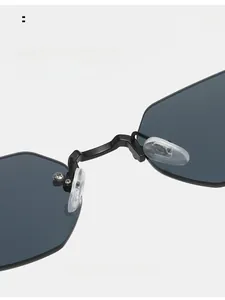 Detail of comfortable silicone nose pads on grey polygon rimless metal sunglasses
