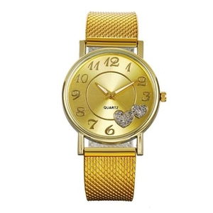 Detail of women's gold mesh strap watch with quartz movement and heart diamond dial decor