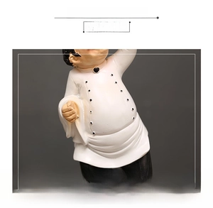 Close-up of resin chef figurine waist detail with matte finish and black buttons