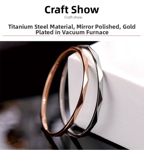 Macro detail of V-shaped titanium steel rings in gold and silver with polished mirror finish