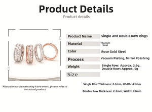 Detail view of titanium steel rings showing width specs and polished finish