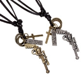 Detail of bronze and silver pendants with cross and tag on black leather cords