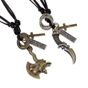 Detail of vintage leather necklaces featuring bronze axe and dagger pendants with small charms