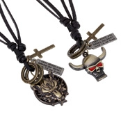 Detail view of leather necklaces with wolf head, skull pendants and cross charms