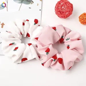 Two-pack of strawberry print scrunchies in white and pink chiffon fabric for women