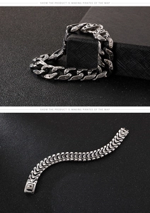 Close-up of punk style stainless steel skull link bracelet with vintage totem patterns