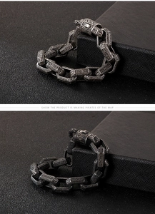 Macro detail of men's punk stainless steel bracelet with engraved vintage patterns
