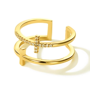 Close-up of double-layer gold cross ring featuring micro-pave cubic zirconia accents