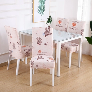 Pink elastic chair cover with ocean patterns including shells and starfish