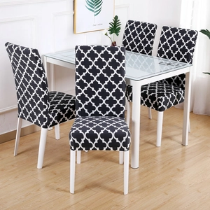 Detail of black and white geometric clover pattern on stretchable dining chair covers