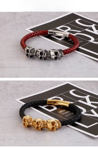 Detail of gothic leather braided bracelets with skull charms and magnetic metal clasps