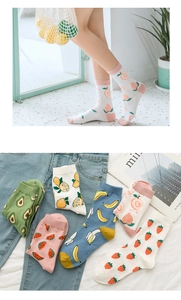 Detailed close-up of vibrant cotton socks with various fruit patterns like peach and lemon
