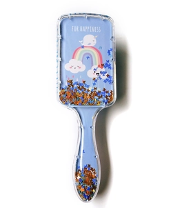 Detail of blue air cushion hairbrush with floating sequins and rainbow narwhal print