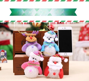 Detailed view of four LED Christmas hanging ornaments featuring Santa, Snowman and Reindeer
