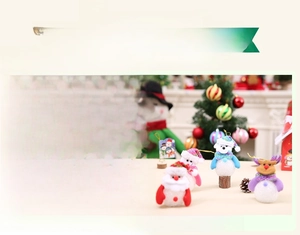 Close-up of EVA glowing Christmas figures including Santa and Snowman with hanging ropes
