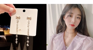 Detail of gold bow long tassel earrings with sparkling zircons and S925 silver needle