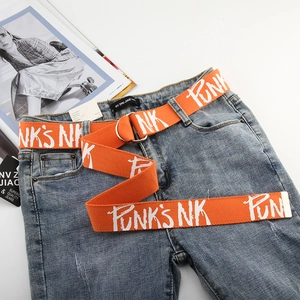 Detail view of orange canvas belt with white graffiti letters and silver double D-ring buckle