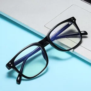 Classic black TR90 square frame glasses with anti-blue light lenses on a laptop