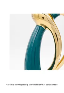 Detail of peacock green ceramic with gold electroplating finish for elegant home decor