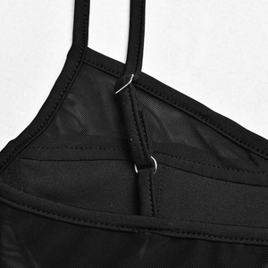 Detail of adjustable straps and sheer mesh fabric on black backless bodysuit