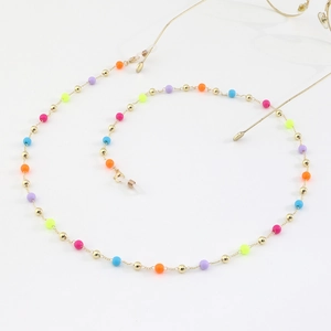 Colorful beaded eyewear chain with gold accents and adjustable silicone loops for glasses
