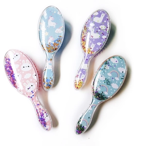 Close-up of transparent hairbrushes with colorful sequins and cute cartoon patterns