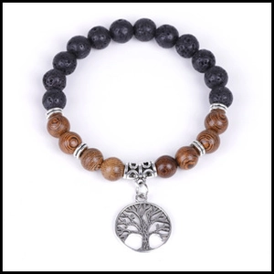 Detailed shot of Tree of Life pendant with volcanic lava and natural wooden beads