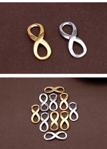 Macro view of gold and silver infinity symbol connectors for DIY jewelry making