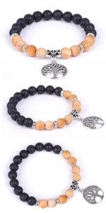 Detailed view of handmade wood bead bracelet with Tree of Life silver pendant charm