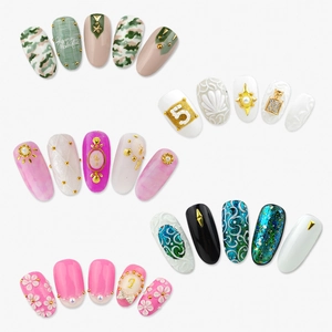 Assorted nail art charms featuring gold rivets and floral patterns in six compartment set