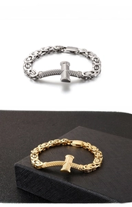 Detail of Byzantine style cross bracelets in gold and silver steel with plug-in clasps