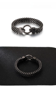 Macro detail of men's titanium steel double-layer scale chain bracelet in vintage style